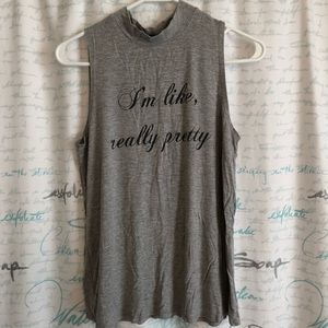 High neck, sleeveless top.